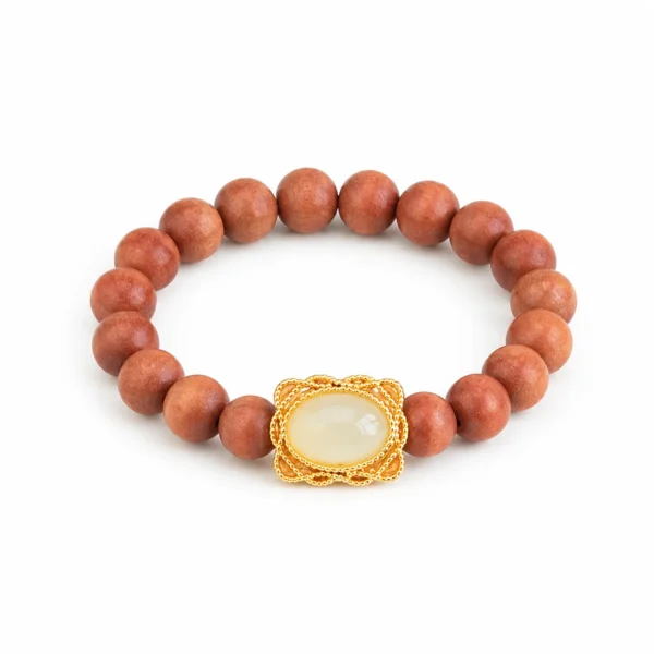 barbie sandalwood beaded ring on white background
