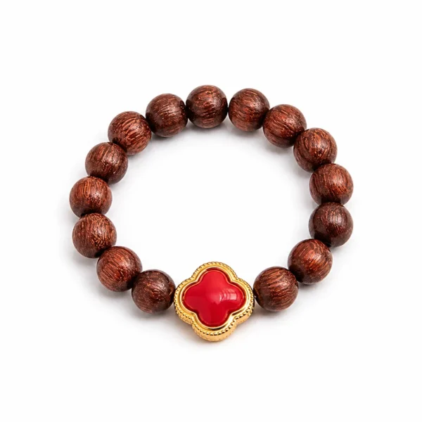 golden sandalwood flower beaded ring on white background