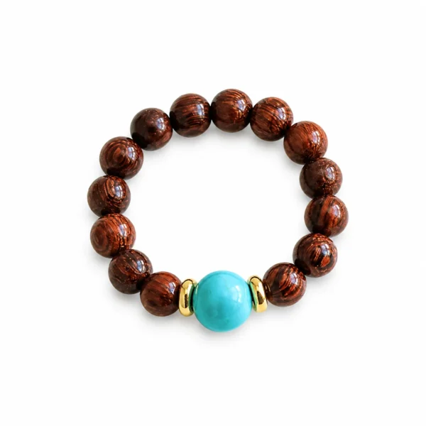 golden sandalwood turquoise beaded ring on white background