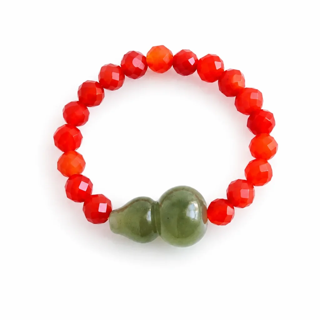 Red Beaded Jade Gourd Ring 1 red beaded jade gourd ring on white background