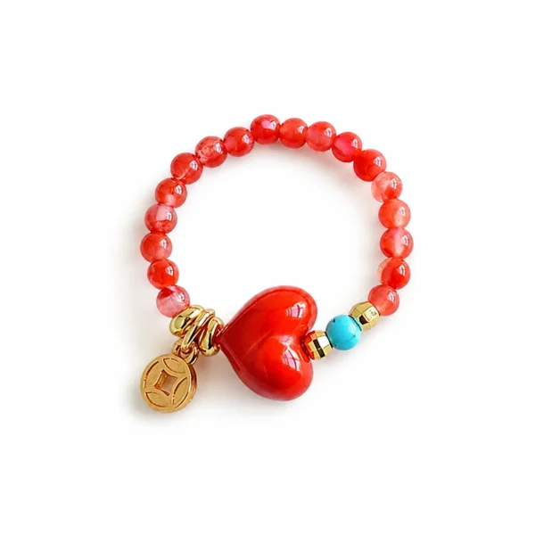 red heart beaded ring turquoise accent on white background