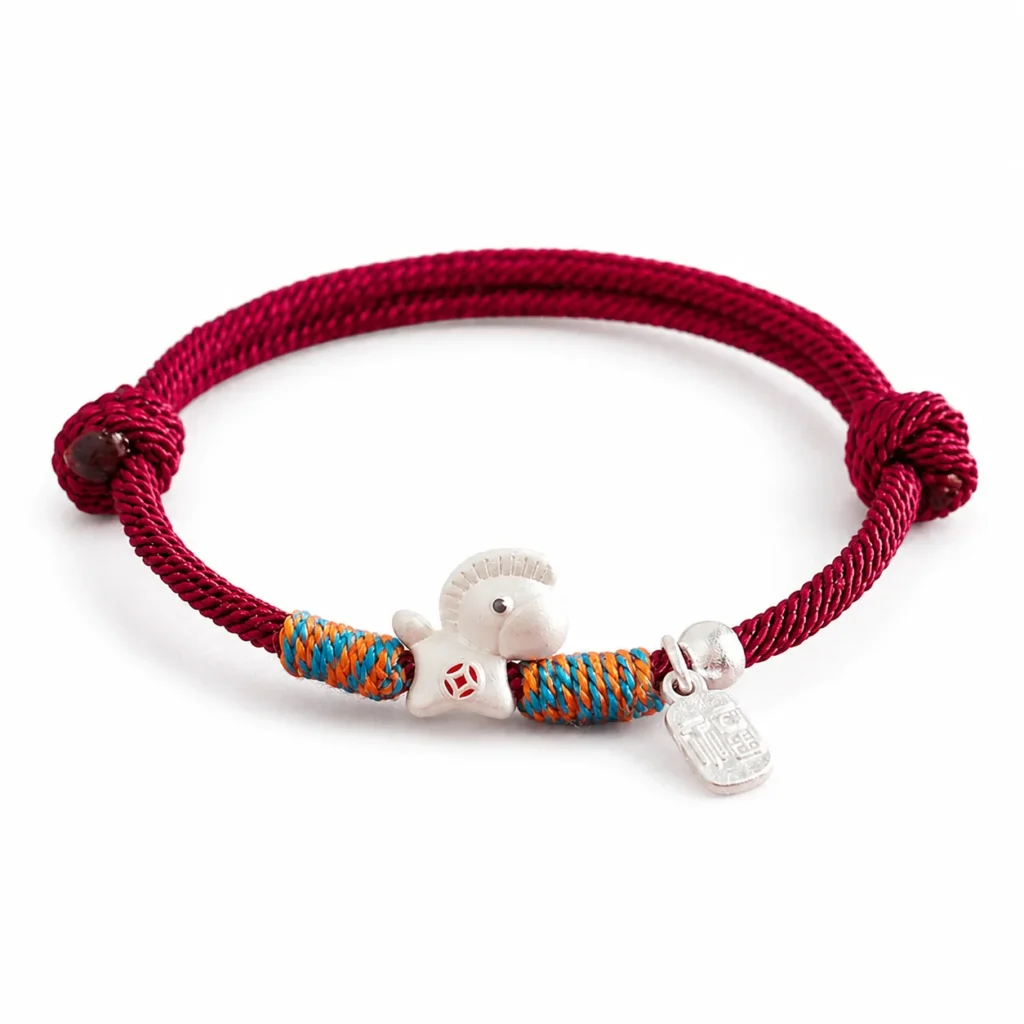red lucky bracelet silver horse charm on white background