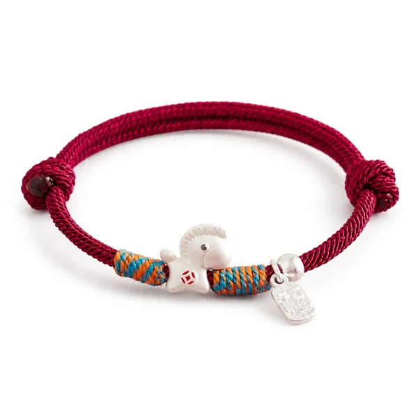 red lucky bracelet silver horse charm on white background