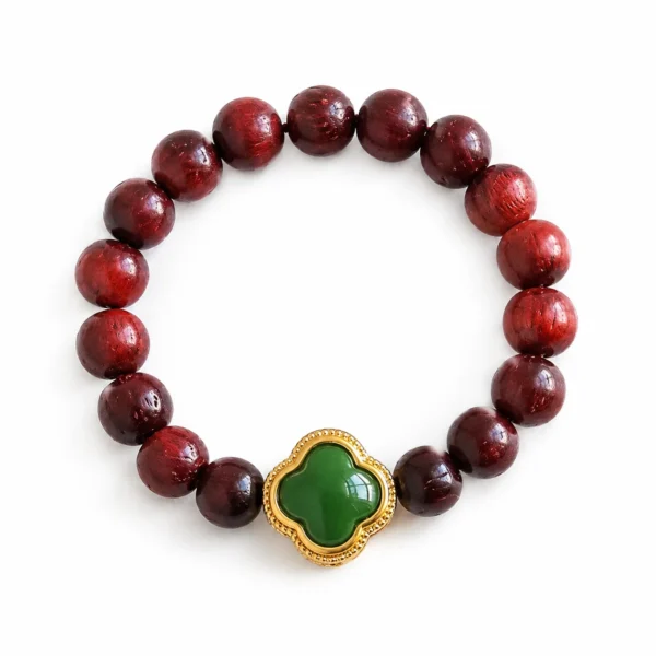 red sandalwood flower beaded ring on white background
