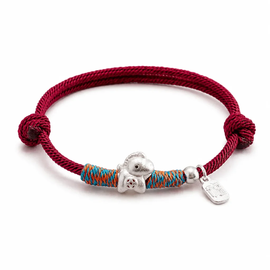Simple Red String Horse Charm Bracelet 1 simple red string horse charm bracelet on white background