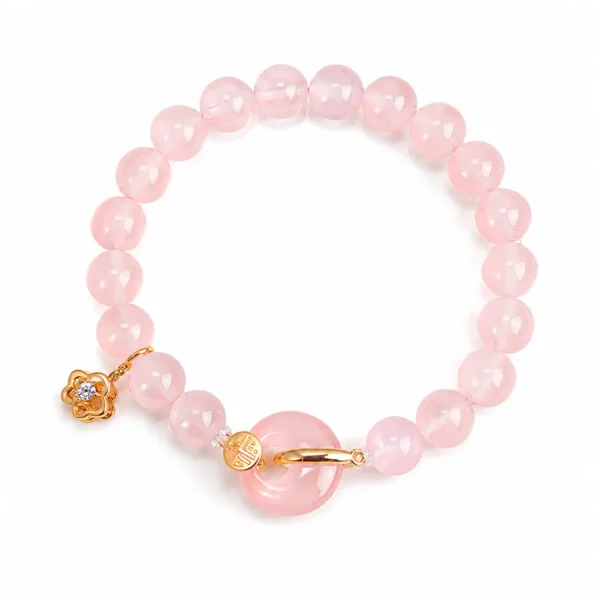 rose quartz gold fu charm bracelet on white background