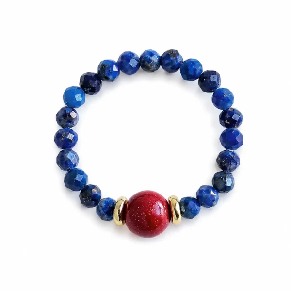 lapis cinnabar beaded ring on white background