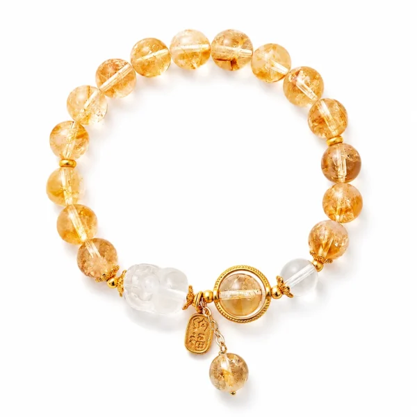 white quartz pixiu bracelet with yellow crystal beads on white background
