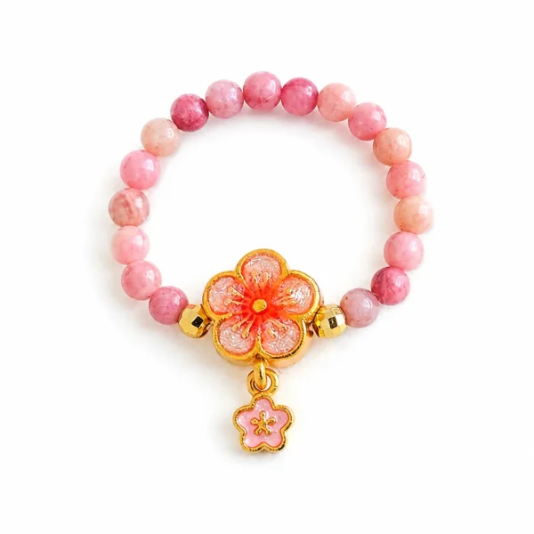 rhodochrosite flower beaded ring on white background