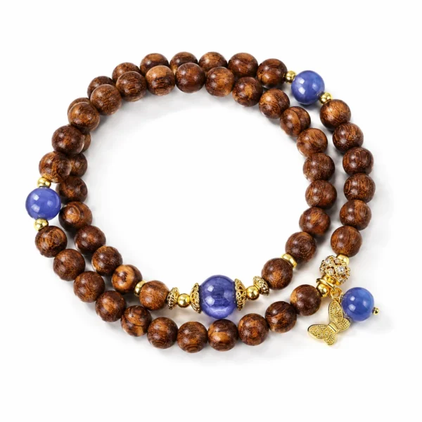 golden sandalwood lapis butterfly double-wrap bracelet on white background