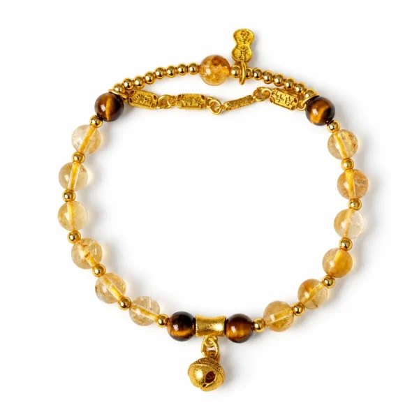 yellow tower crystal bell charm bracelet on white background