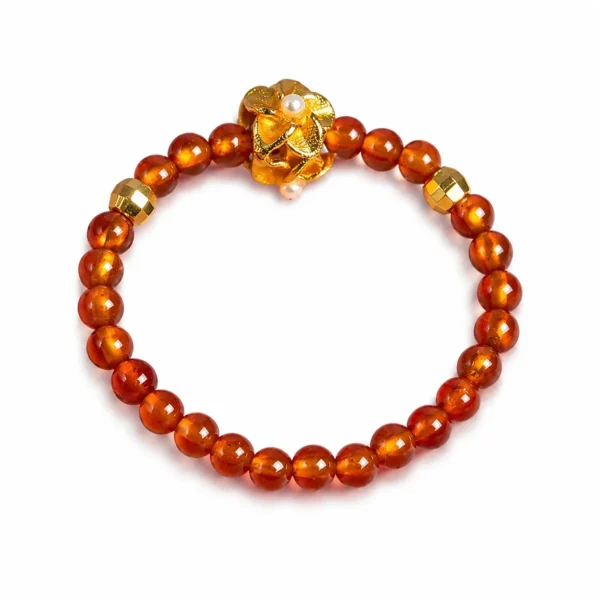 garnet flower beaded ring on white background