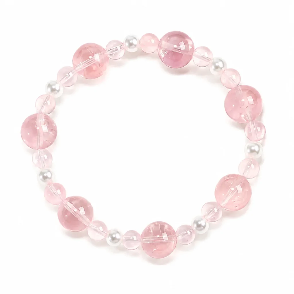 petite rose quartz beaded bracelet on white background