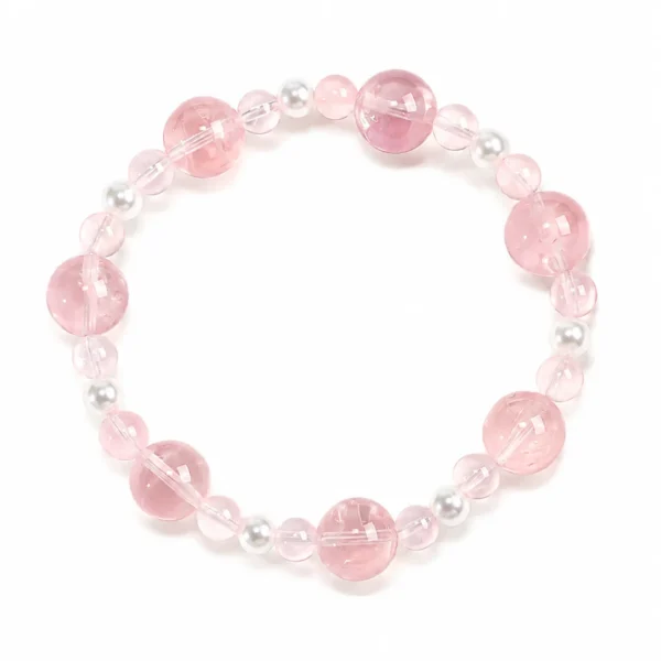 petite rose quartz beaded bracelet on white background