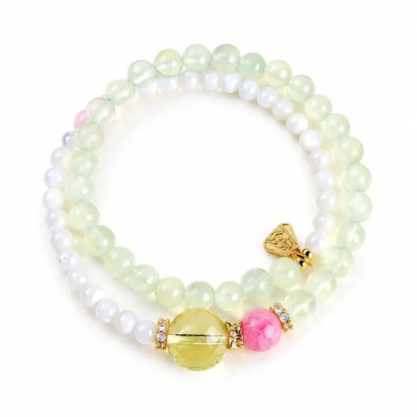 prehnite cowrie double-wrap bracelet on white background