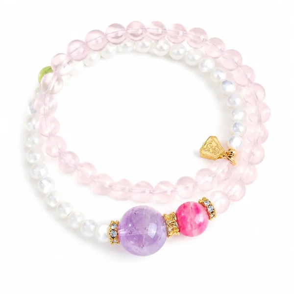 rose quartz cowrie double-wrap bracelet on white background
